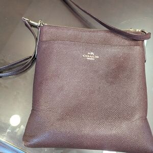 Maroon cross body Coach purse